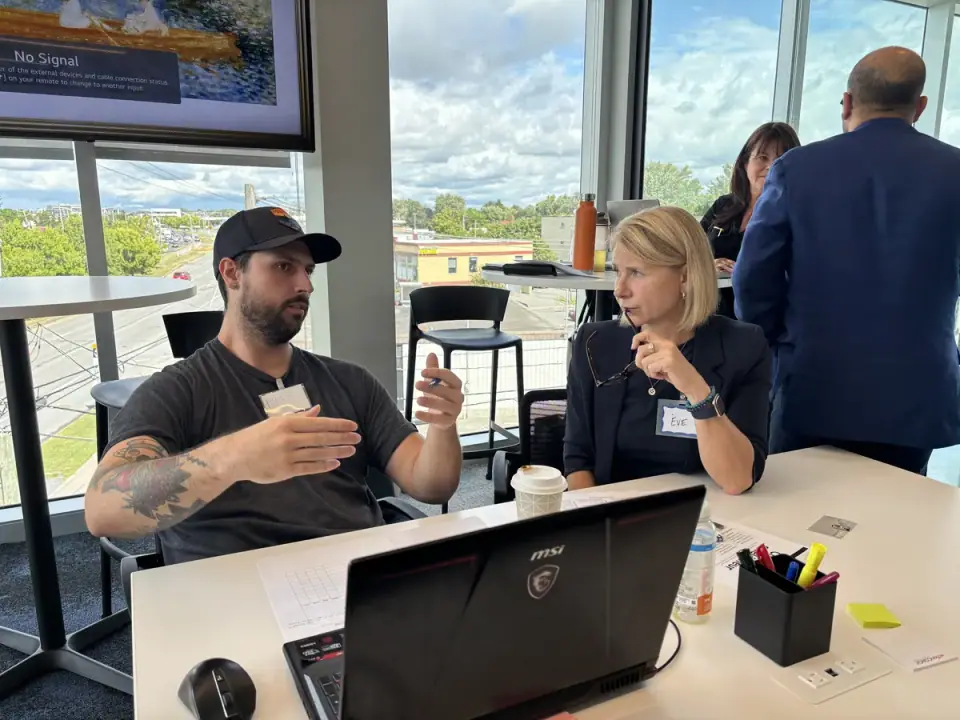 Business owners working through ideas at a workshop table